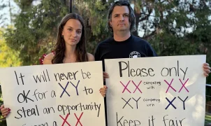 Dad banned from school grounds after protesting trans runner competing against his daughter