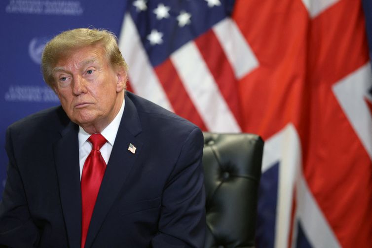 US President Donald Trump looks on during a meeting with Britain
