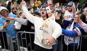 Brewers' World Series celebration gets rowdy as star makes outrageous beer promise, coach sings karaoke