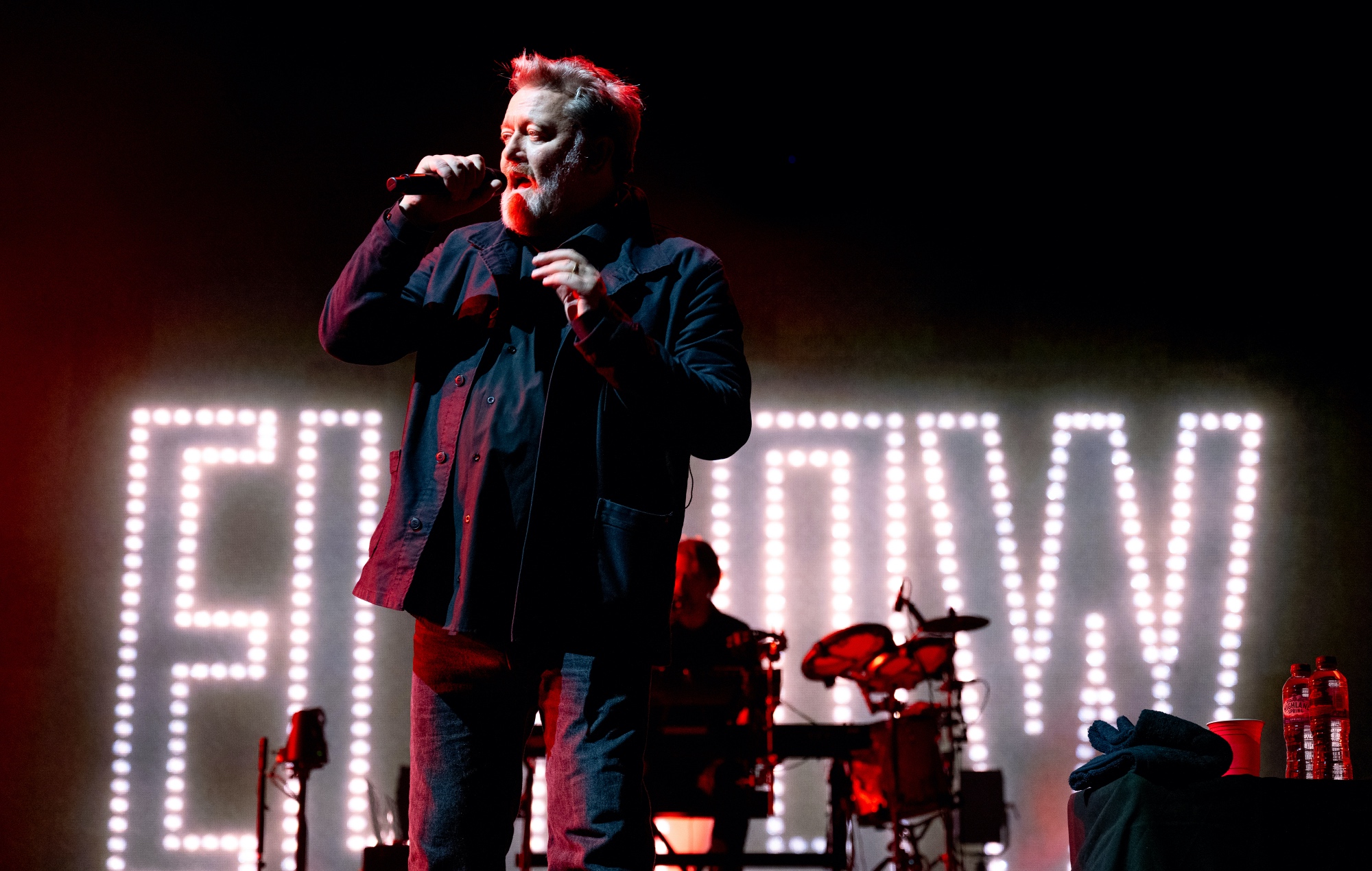 Guy Garvey performing live on stage with Elbow