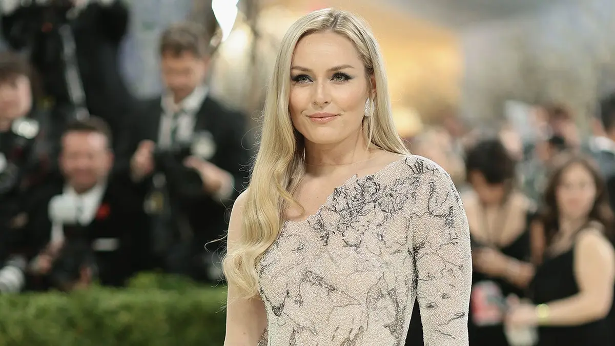 Lindsey Vonn standing in a black dress at the Met Gala in New York City.