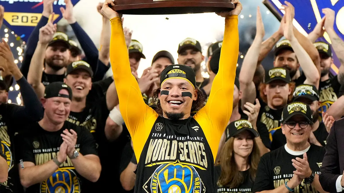 William Contreras holds the MVP trophy after the Brewers win the World Series.