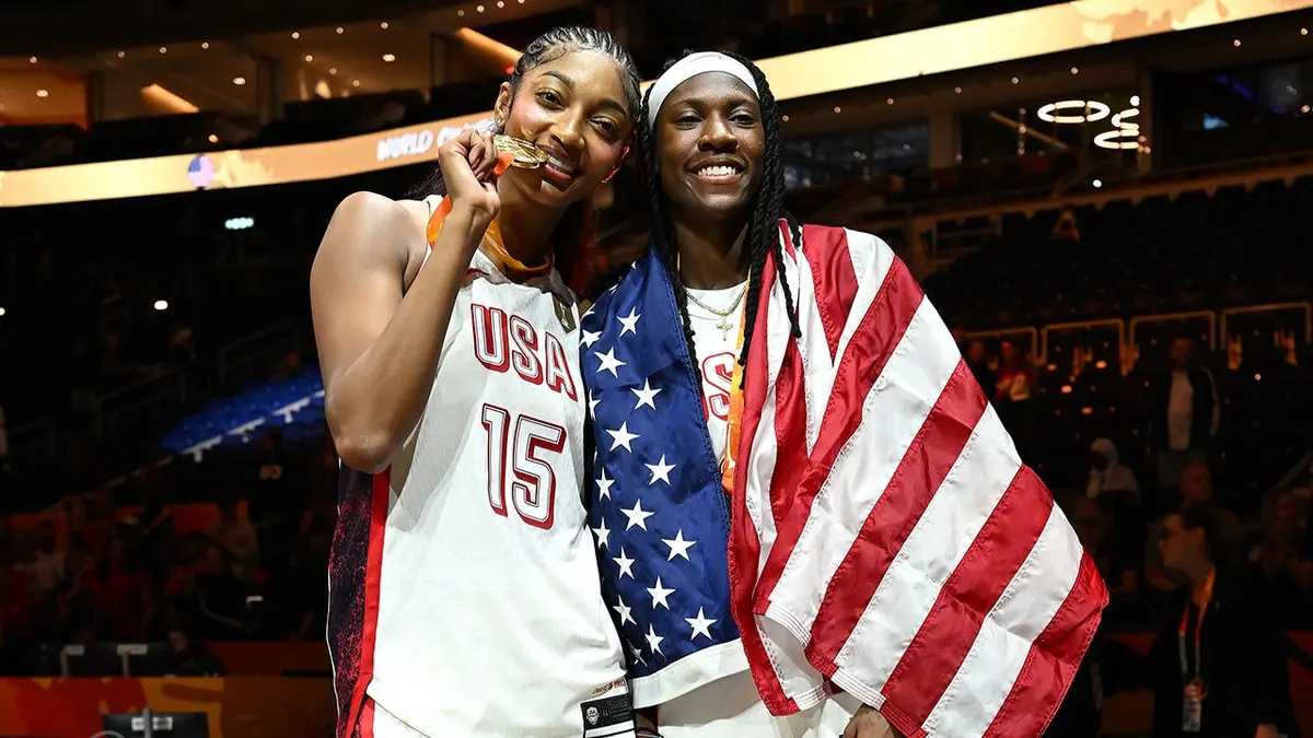 Angel Reese and Rhyne Howard of USA Basketball pose for a photo after the game in Berlin.