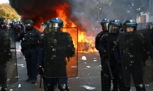 Macron heads to Kuwait for energy talks while France riots rage on