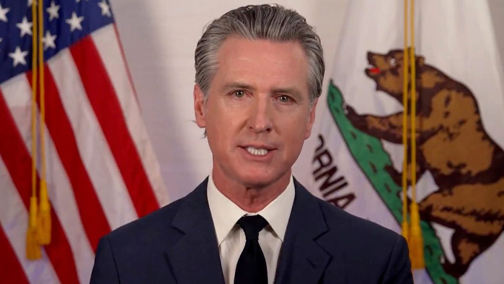 Newsom video address in front of American and Californian flags
