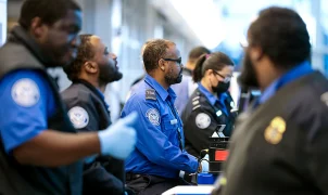 TSA now requires its airport security officers to stand at passenger checkpoints